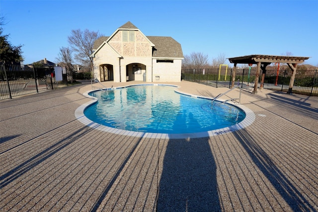 view of swimming pool featuring a patio area and a pergola