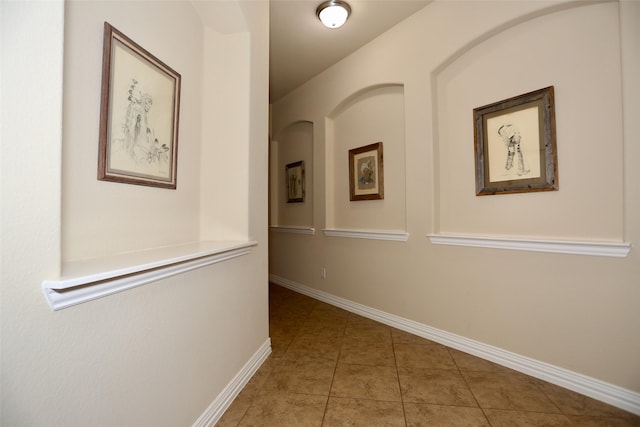 hall featuring tile patterned flooring