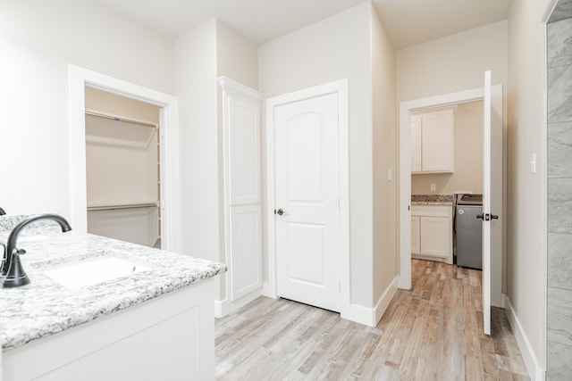 bathroom with vanity and hardwood / wood-style flooring