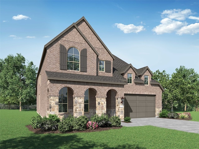 view of front of home with a garage and a front yard