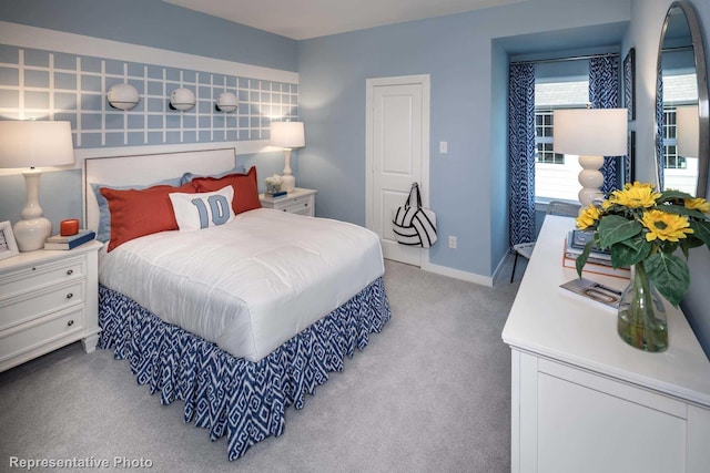 bedroom featuring light colored carpet