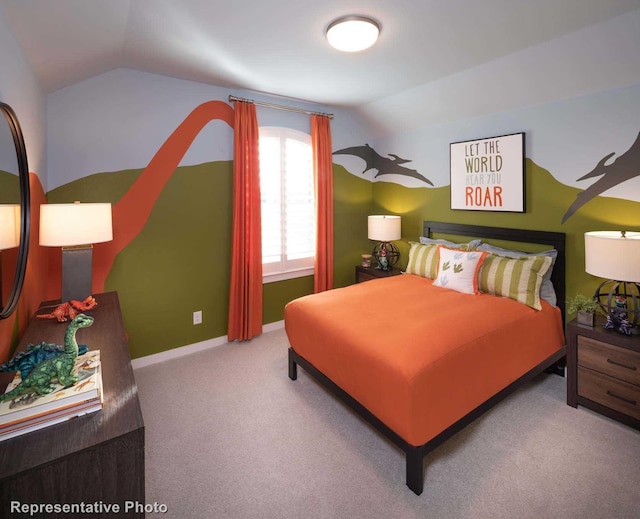 carpeted bedroom with vaulted ceiling