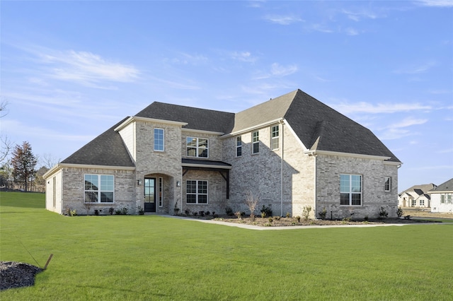 french country style house with a front lawn