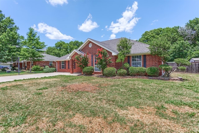 ranch-style home featuring a front yard