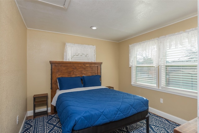 bedroom with hardwood / wood-style floors