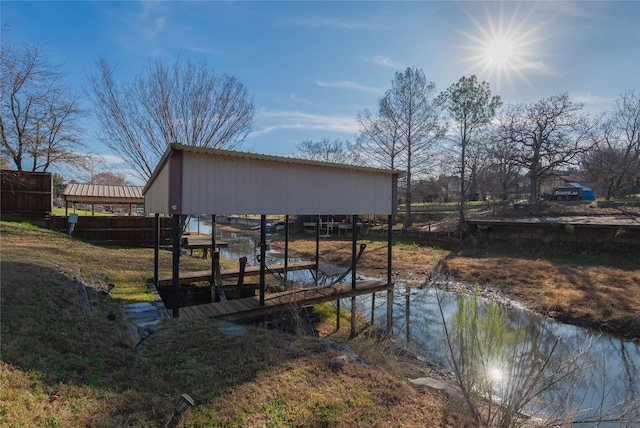 dock area with a water view