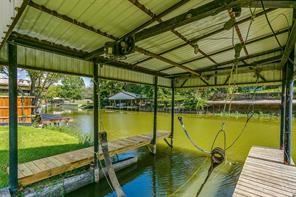 dock area featuring a yard and a water view