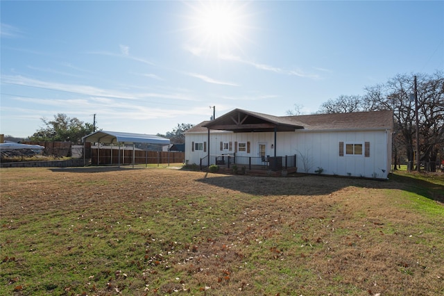 rear view of house with a lawn