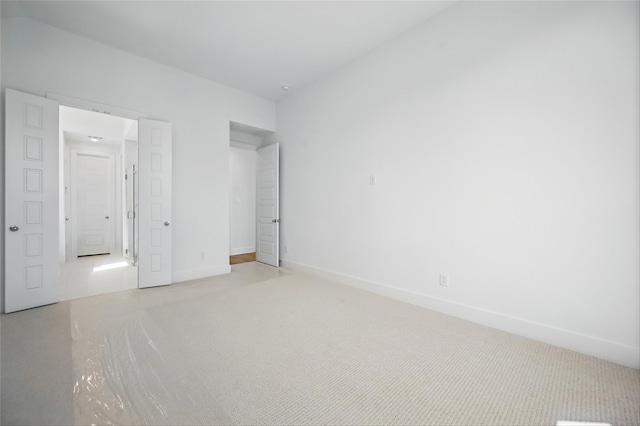 unfurnished bedroom featuring baseboards