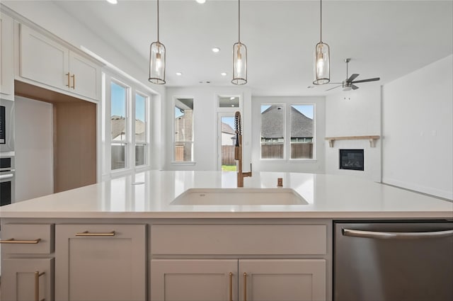 kitchen featuring light countertops, appliances with stainless steel finishes, recessed lighting, and decorative light fixtures