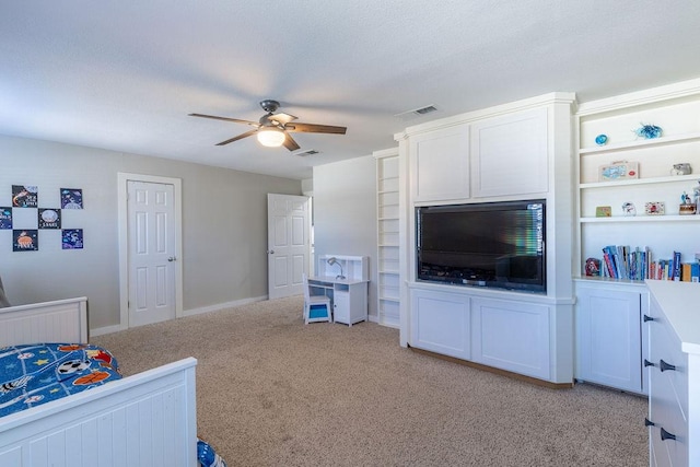 bedroom with ceiling fan and light colored carpet