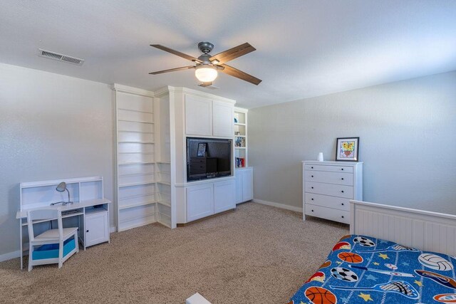 bedroom with ceiling fan and light carpet