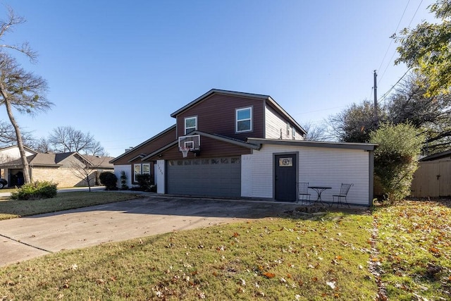 front of property with a garage and a front yard