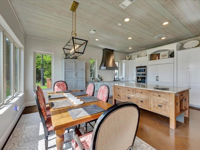 dining room with visible vents, baseboards, recessed lighting, wooden ceiling, and dark tile patterned flooring