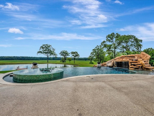 view of pool featuring a water view