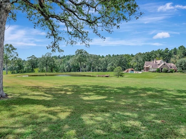 view of yard with a forest view