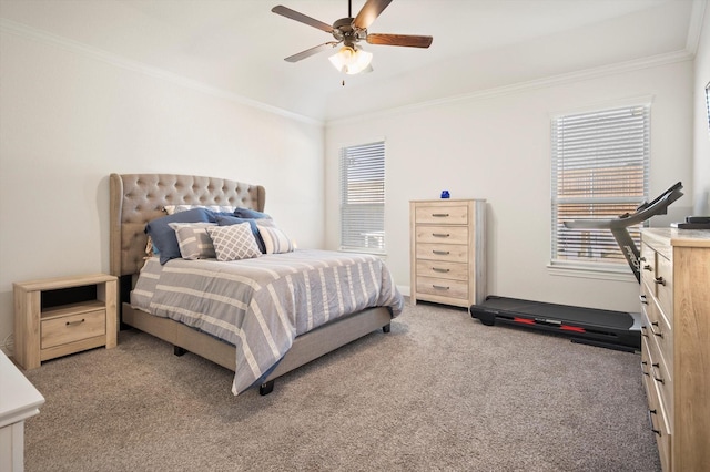 carpeted bedroom featuring ceiling fan and ornamental molding