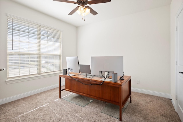 home office featuring ceiling fan, a healthy amount of sunlight, and carpet floors