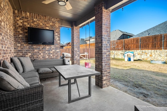 view of patio / terrace featuring ceiling fan