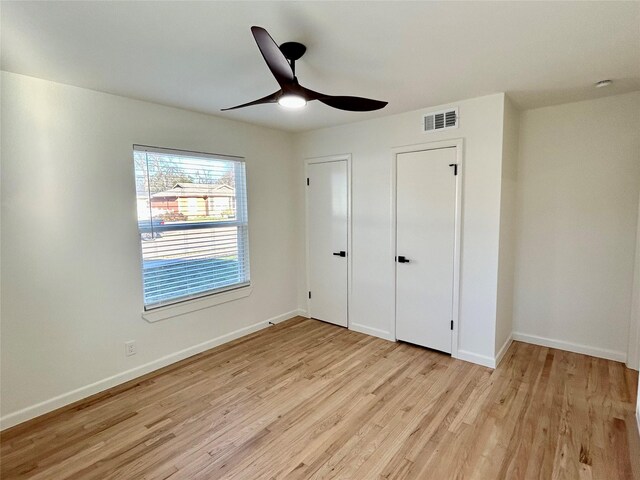 unfurnished bedroom featuring ceiling fan and light hardwood / wood-style flooring