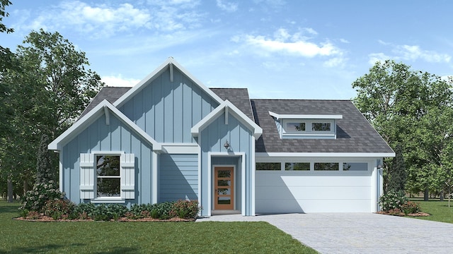 view of front facade with a garage and a front lawn