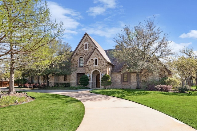 tudor house with a front lawn