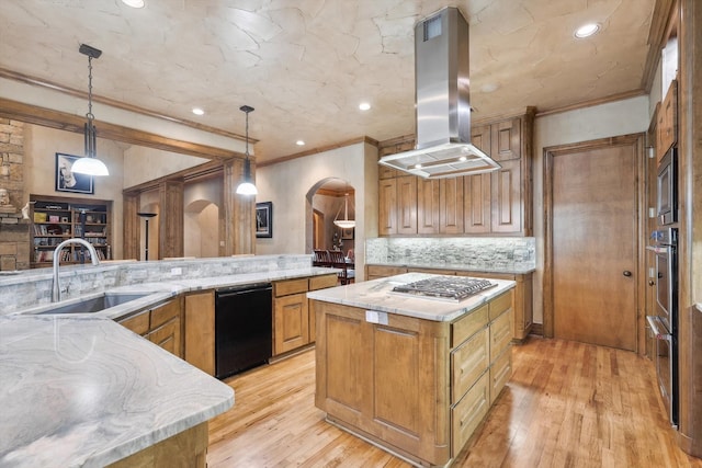 kitchen featuring a spacious island, sink, hanging light fixtures, decorative backsplash, and island exhaust hood