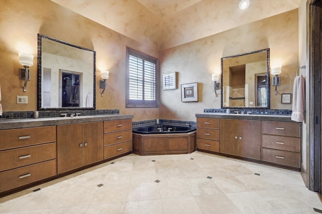 bathroom featuring vanity and a tub