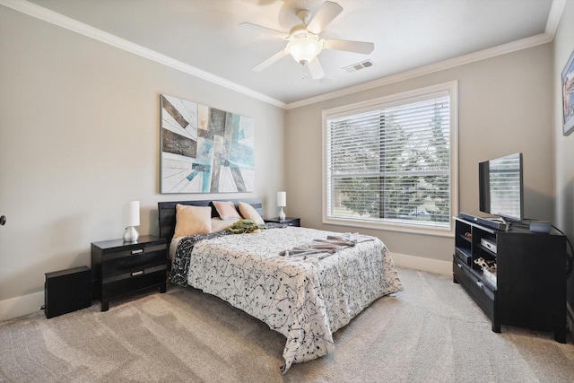 bedroom featuring ceiling fan, crown molding, and light colored carpet