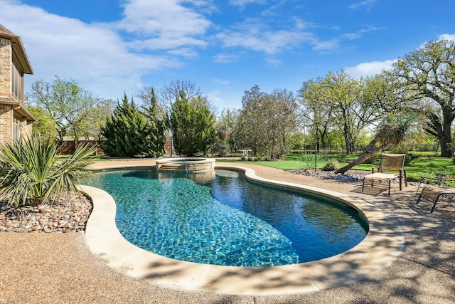 view of pool featuring an in ground hot tub and a patio