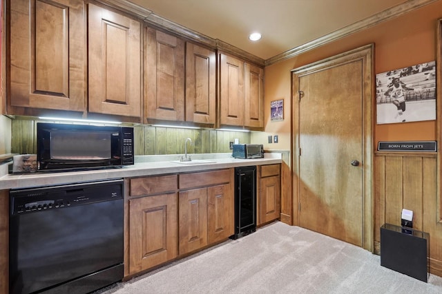 kitchen with ornamental molding, light colored carpet, sink, black appliances, and wine cooler