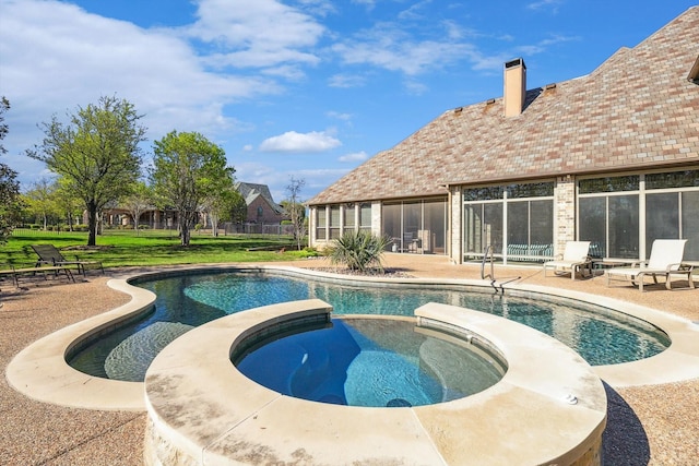 view of swimming pool with an in ground hot tub and a patio