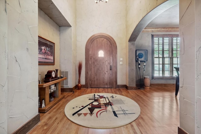 entryway with wood-type flooring