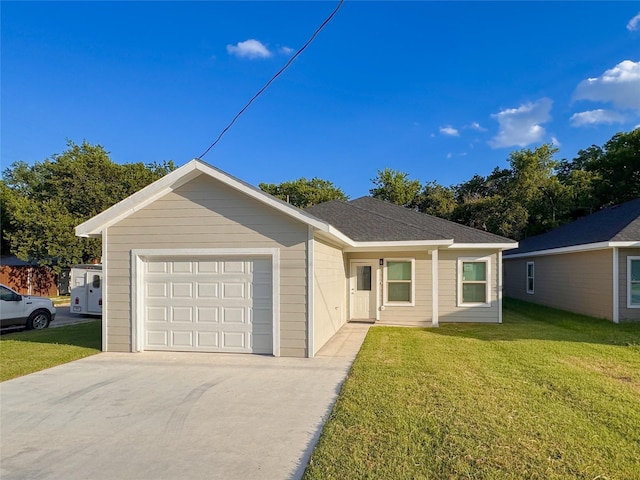 ranch-style house featuring a garage and a front yard