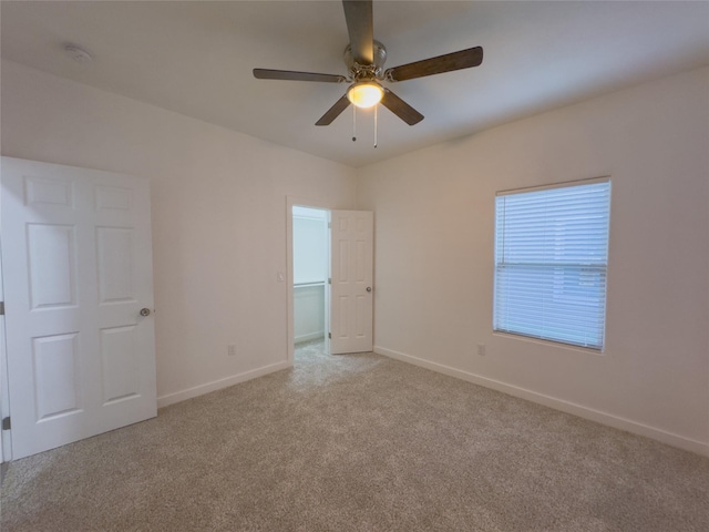 carpeted empty room with ceiling fan