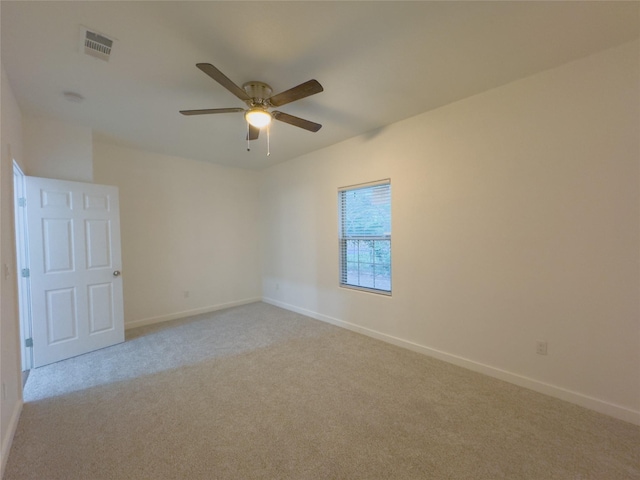 carpeted empty room featuring ceiling fan