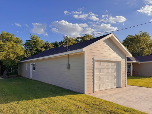 garage with a yard