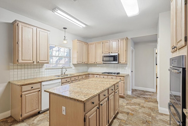 kitchen featuring sink, a center island, light brown cabinets, and appliances with stainless steel finishes