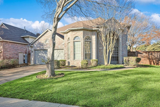 view of front of house featuring a front yard and a garage