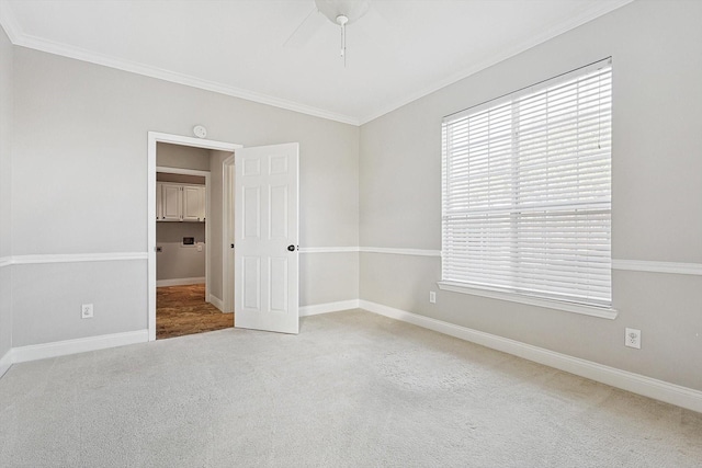 unfurnished bedroom with carpet floors, ceiling fan, and ornamental molding