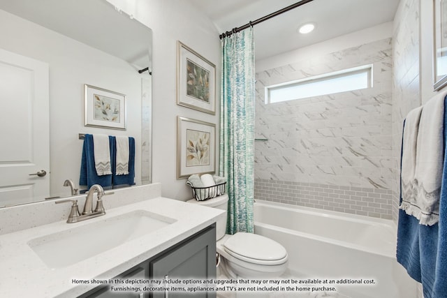 full bathroom featuring vanity, toilet, and shower / bathtub combination with curtain