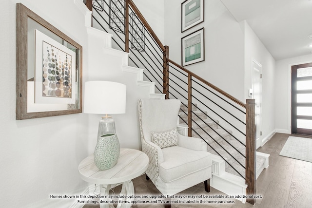 stairs with hardwood / wood-style flooring