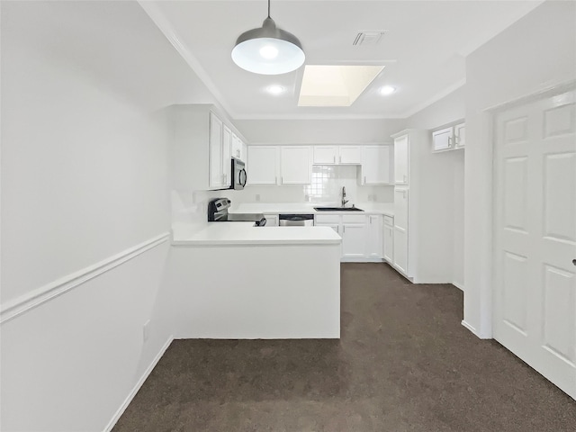 kitchen featuring white cabinetry, sink, hanging light fixtures, kitchen peninsula, and appliances with stainless steel finishes