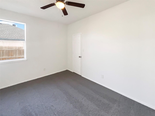 carpeted empty room with ceiling fan