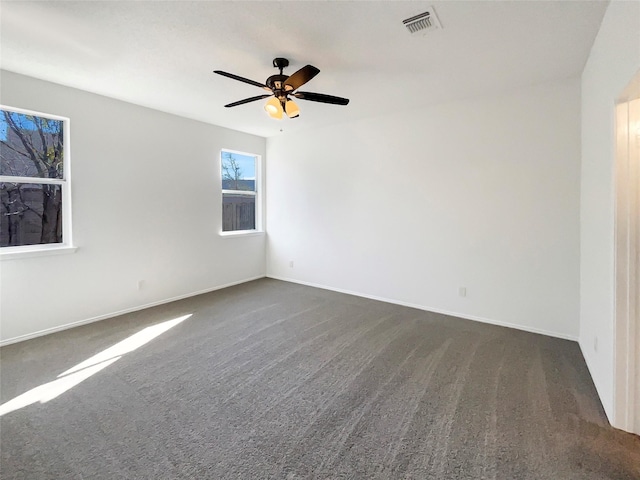 carpeted empty room with ceiling fan