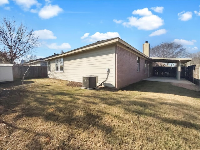 view of home's exterior featuring a yard, cooling unit, and a patio