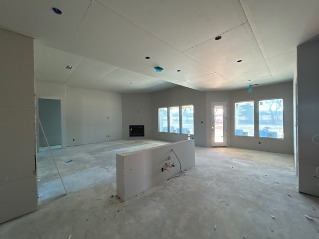 kitchen featuring a fireplace, open floor plan, and light countertops