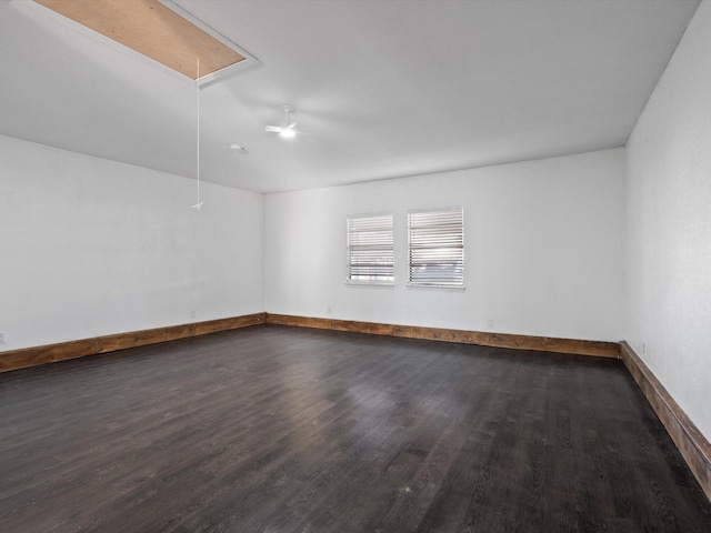 spare room featuring dark hardwood / wood-style floors