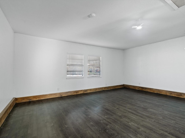 unfurnished room with dark hardwood / wood-style floors