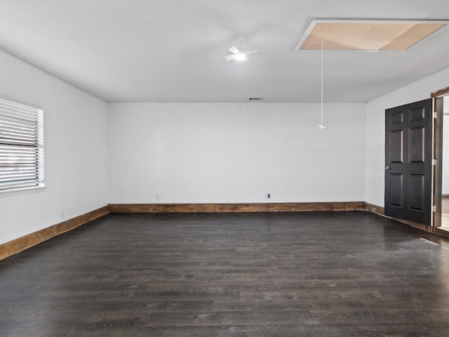 empty room featuring dark hardwood / wood-style floors